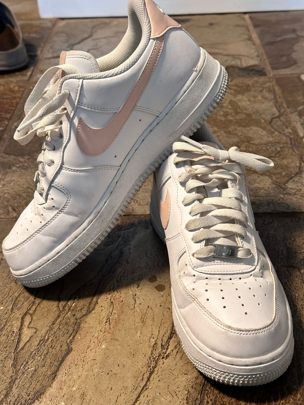 Nike Women’s Air Force Low-Top Sneakers in White with Pale Pink Swoosh
